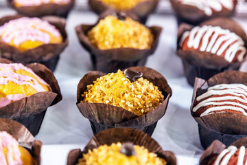 muffins with different flavors, fillings and different sprinkles