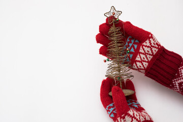 Woman hand with chrismas toy isolated on white