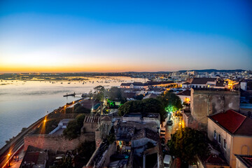 Faro cityscape by sunset - historic architecture and Ria Formosa, Portugal
