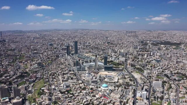 Top view of Amman Jordan city. Aerial Drone fly over futuristic Abdali area district on beautiful day. Residential Modern skyscraper buildings