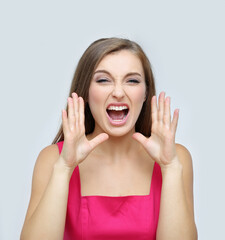 Fototapeta premium Portrait of beautiful girl screaming at the camera