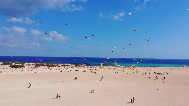 kite fest fuerteventura, Spain , festival de cometas , kite in turquoise water and white beach in canary island, drone 4K footage