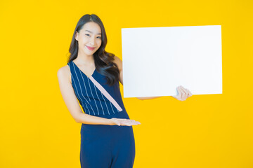 Portrait beautiful young asian woman with empty white billboard