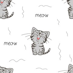 Seamless pattern with cute tabby kitten and hand-drawn text