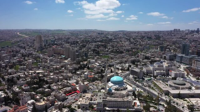 The dome of an Islamic mosque in Amman, Jordan. King Abdullah I Blue Mosque. Drone top shot
