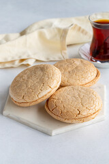 Acıbadem macaroon on a white background. Traditional Turkish cuisine flavor. delicious cookies. Story format. Local name acıbadem kurabiyesi