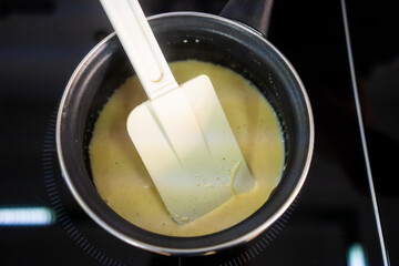  Pastry maker making chocolate for making the cake.