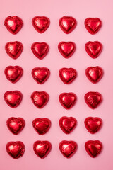Red heart chocolate candy on Pink Background St Valentine Holiday Background Dessert for Valentine...