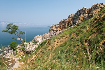 Fototapeta na wymiar Looking from Shamanka rock to Sayan mountains on Olkhon Island, Russia