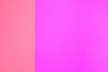 Two colored papers with a pacific pink and velvet violet overlay on the floor. The divide half of the image. Dual background, flat lay