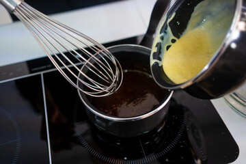  Pastry maker making chocolate for making the cake.