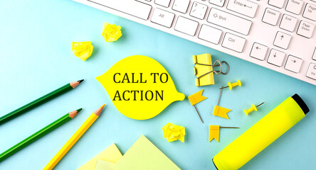 Text sign showing CALL TO ACTION with office tools and keyboard on blue background