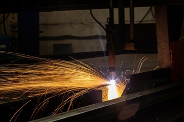 Plasma welding and metal cutting in industry. High-tech production processes at the plant