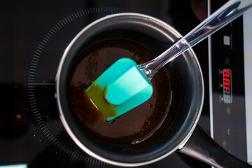  Pastry maker making chocolate for making the cake.