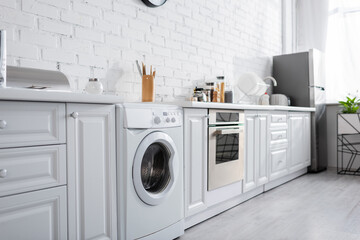 modern kitchen with white household devices