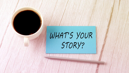 WHAT'S YOUR STORY text on the blue sticker with cofee and pen