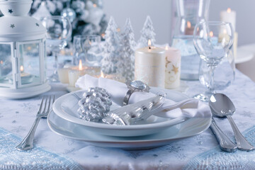 Festive Christmas table in snowy white