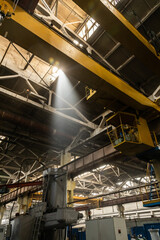 The interior of an old manufacturing plant. Large hangar in a factory with many special machines and technological equipment without people