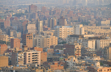 Naklejka na ściany i meble Cairo from above. Top view over the buildings from capital of Egypt country during a summer sunset.