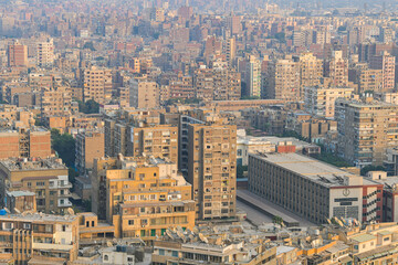Fototapeta na wymiar Cairo from above. Top view over the buildings from capital of Egypt country during a summer sunset.