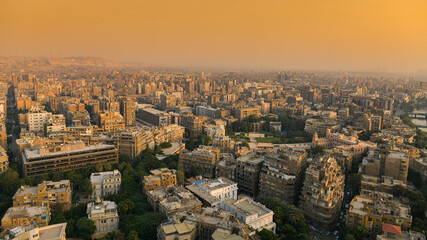 Cairo from above. Top view over the buildings from capital of Egypt country during a summer sunset. - obrazy, fototapety, plakaty