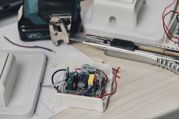 Repair of electronic devices, tin soldering parts. Hands of man holding screwdriver. Computer...