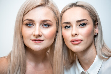 Fototapeta premium Two blonde women portrait in beauty salon