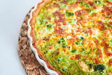 Salmon quiche and broccoli close-up