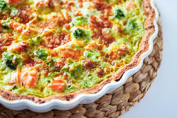 Salmon quiche and broccoli close-up
