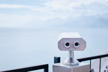 Coin Operated Binocular viewer next to the waterside promenade  looking out to the bay and city.