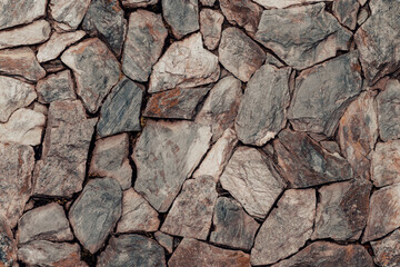 Piedra natural colocada en pared para decoración
 