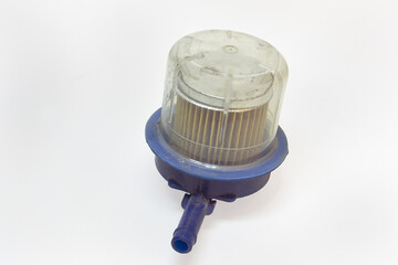 replaceable fuel filter with transparent sump, in plastic housing, old, dismantled for replacing, on white background, with clipping path