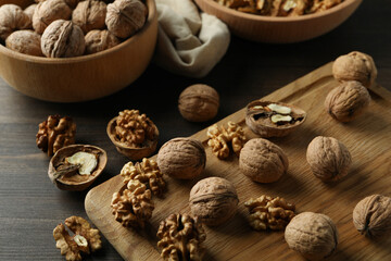 Concept of healthy food with walnuts on wooden background