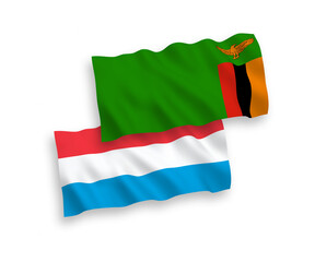 Flags of Republic of Zambia and Luxembourg on a white background