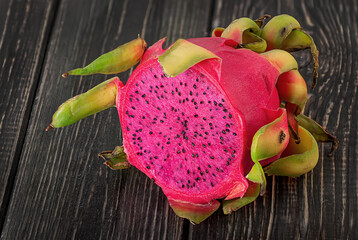 Half dragon fruit on a wooden planks