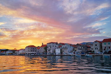 Beautiful sunset landscape. Old croatian town on the sea shore.