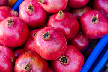 Fresh ripe pomegranates in the box