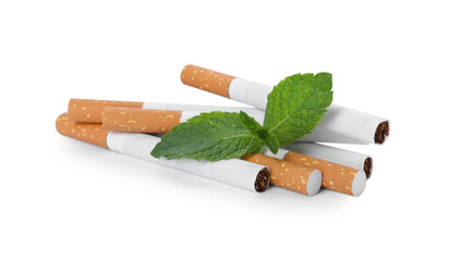 Menthol cigarettes and fresh mint leaves on white background