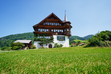 Fototapeta na wymiar Travel by Switzerland. Swiis architecture. Ancient wooden house.
