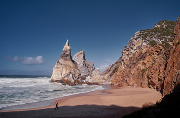 Cliffs and rocks on the Atlantic ocean coast - Praia da Ursa beach, Portugal.