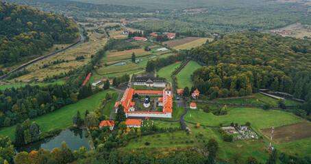 Sambata de Sus, Romania - 2021: Aerial view over Sambata de Sus orthodox Monastery. Religious landmarks in Romania at the bottom of Fagaras Mountains.