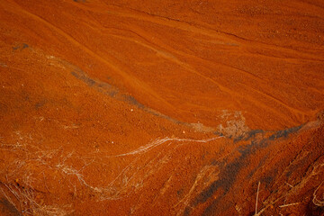 a stretch of red earth in the form of a texture