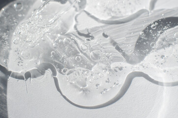 Transparent gel structure with air bubbles, close-up. Gel in a petri dish