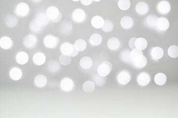 Beautiful blurred bokeh background of white lights garlands. Festive background