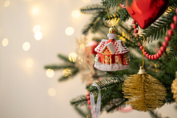 Christmas bauble on Christmas tree with lights bokeh background