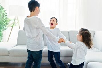 childs having fun on living room at home