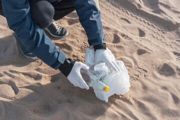 global environment problems conversation, person holding garbage outdoors, cleaning our ecosystem