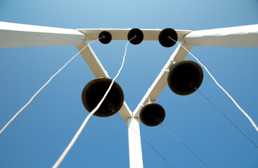 six orthodox bells on a wooden plinth