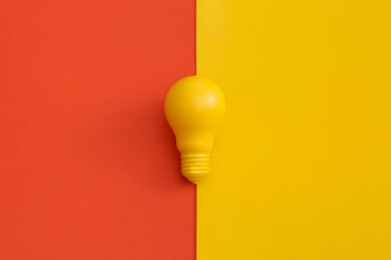 Light bulb on color background. Inspiration and creative idea concept. Top view with copy space. Flat lay composition.