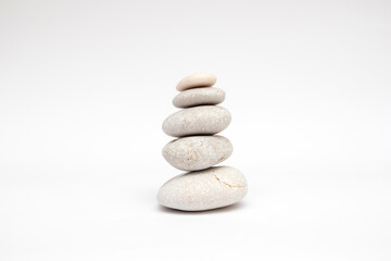 Fototapeta na wymiar Pebbles stones balance on white background
